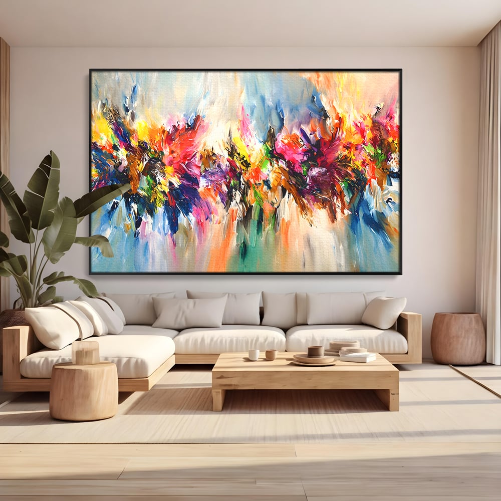 Tablou canvas cu pictura abstracta cu explozie de culoare, in rama de aluminiu negru, pe perete intr-un living